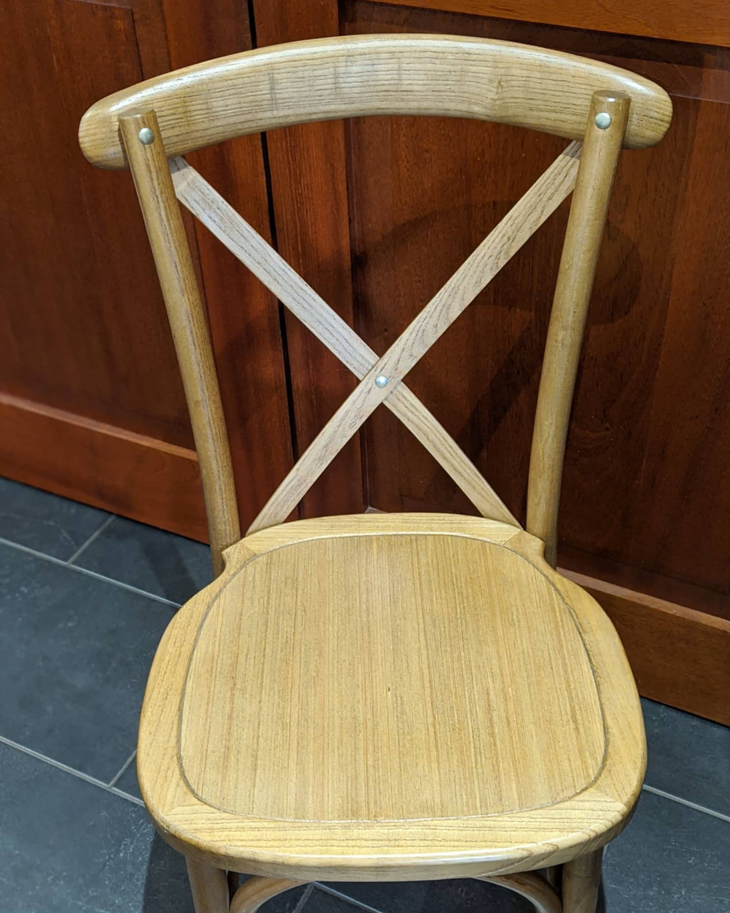 Cross back chair without seat cushion